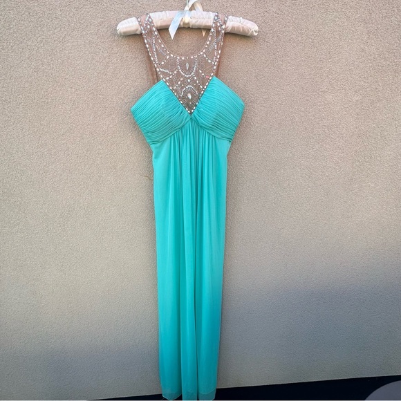 Beautiful long dress
In Aqua blue. - Picture 1 of 7